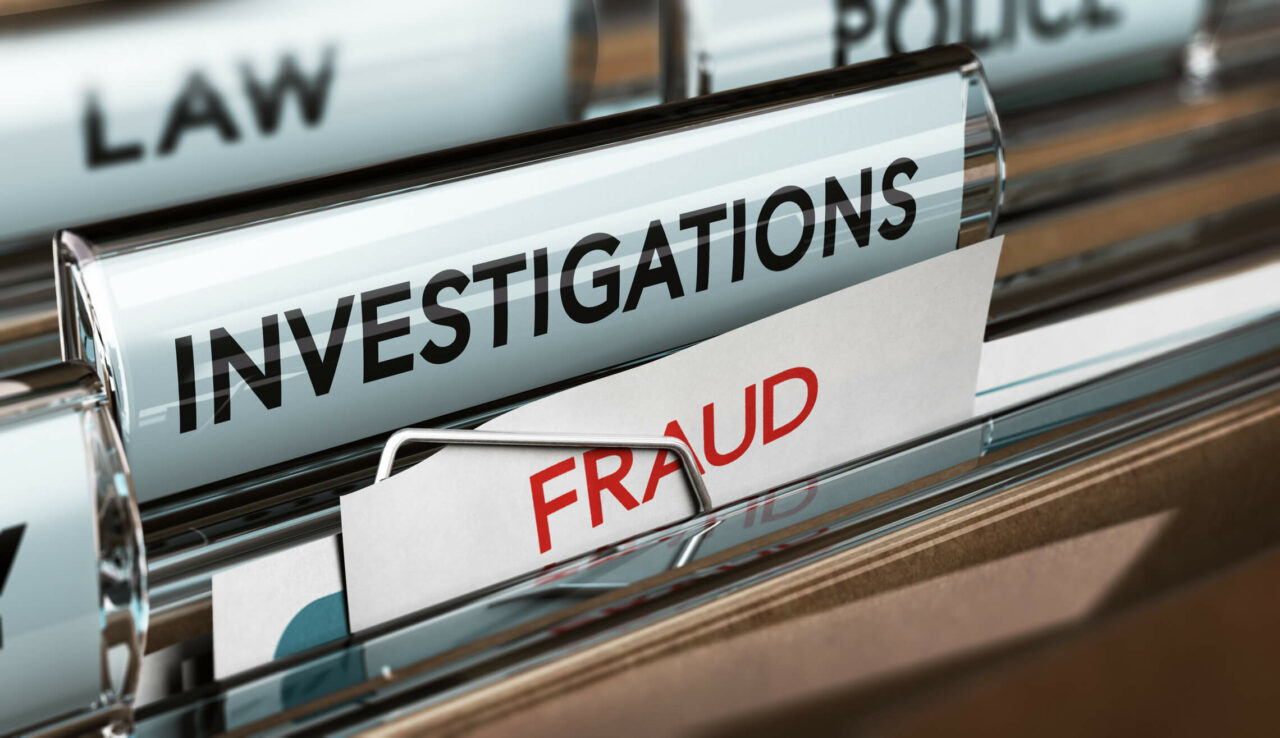 File titled investigations with fraud in red